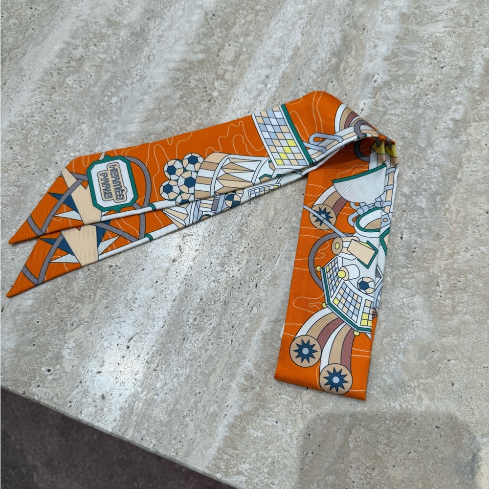 Hermès Silk Odyssey Twilly in orange, vert, and jaune